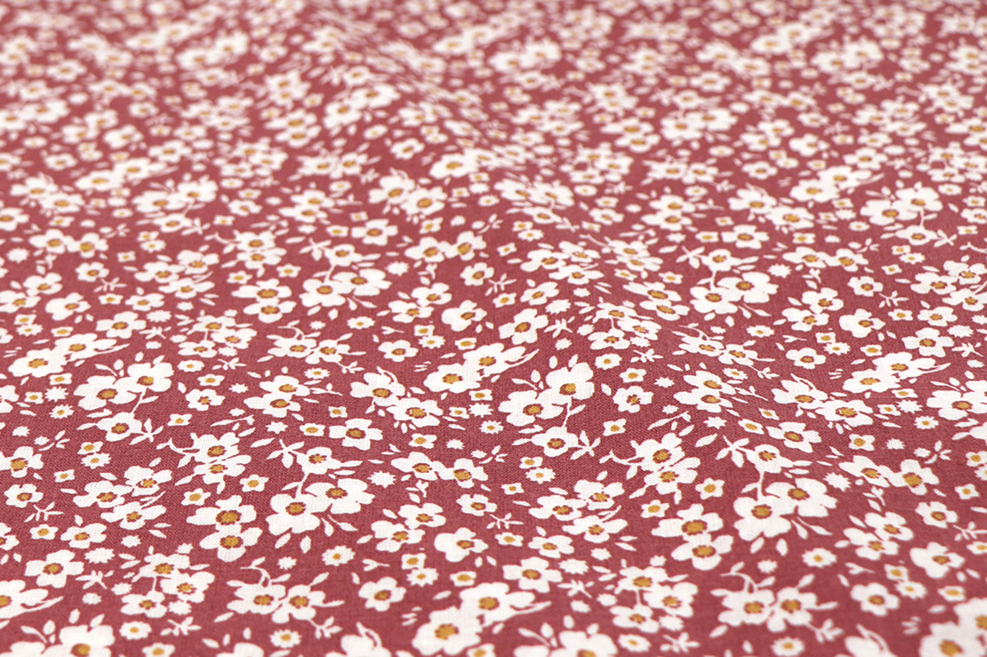 Popeline di cotone, fiorellini bianchi su terracotta