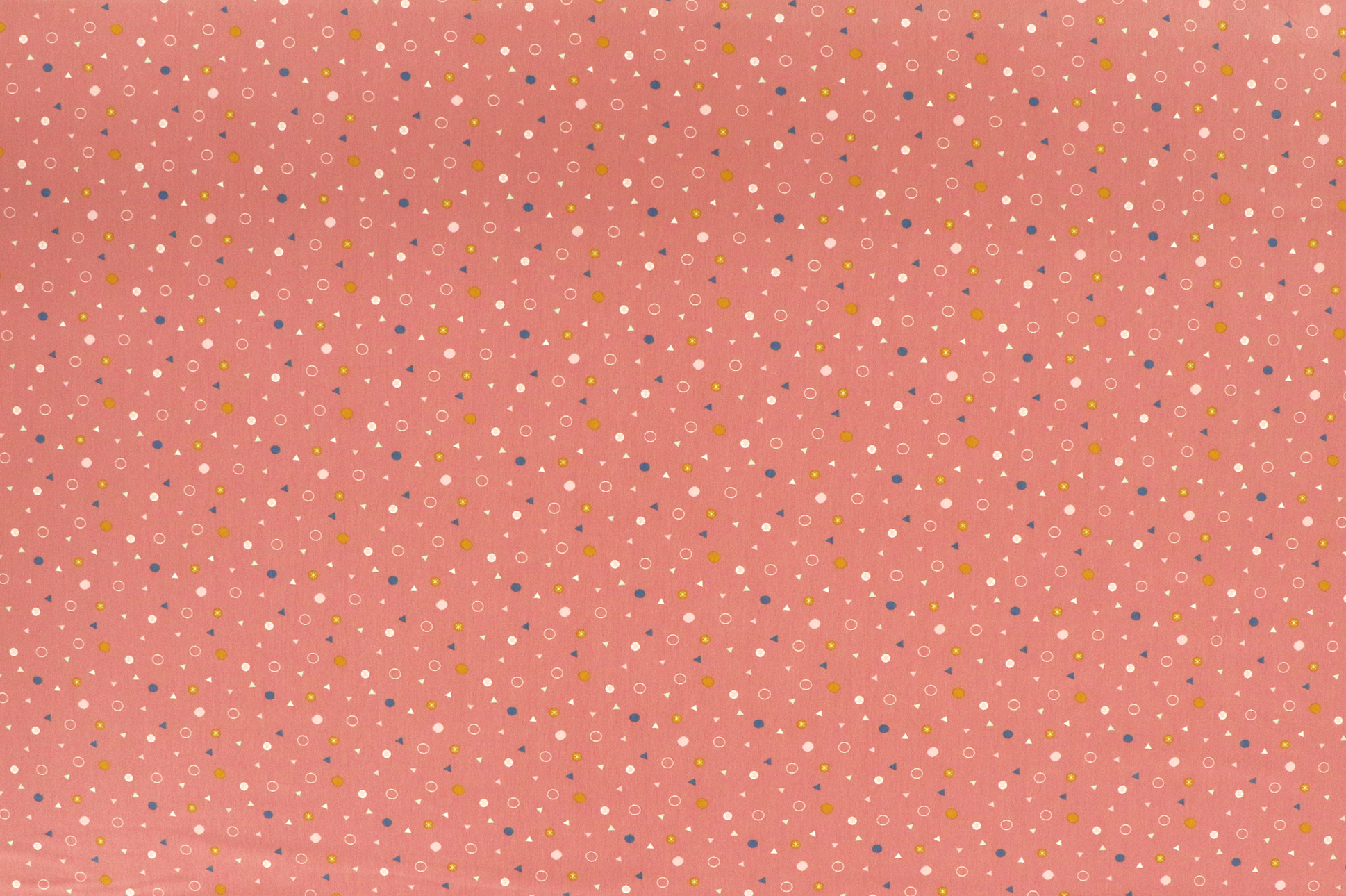 Jersey di cotone, cerchi e triangoli colorati su rosa antico